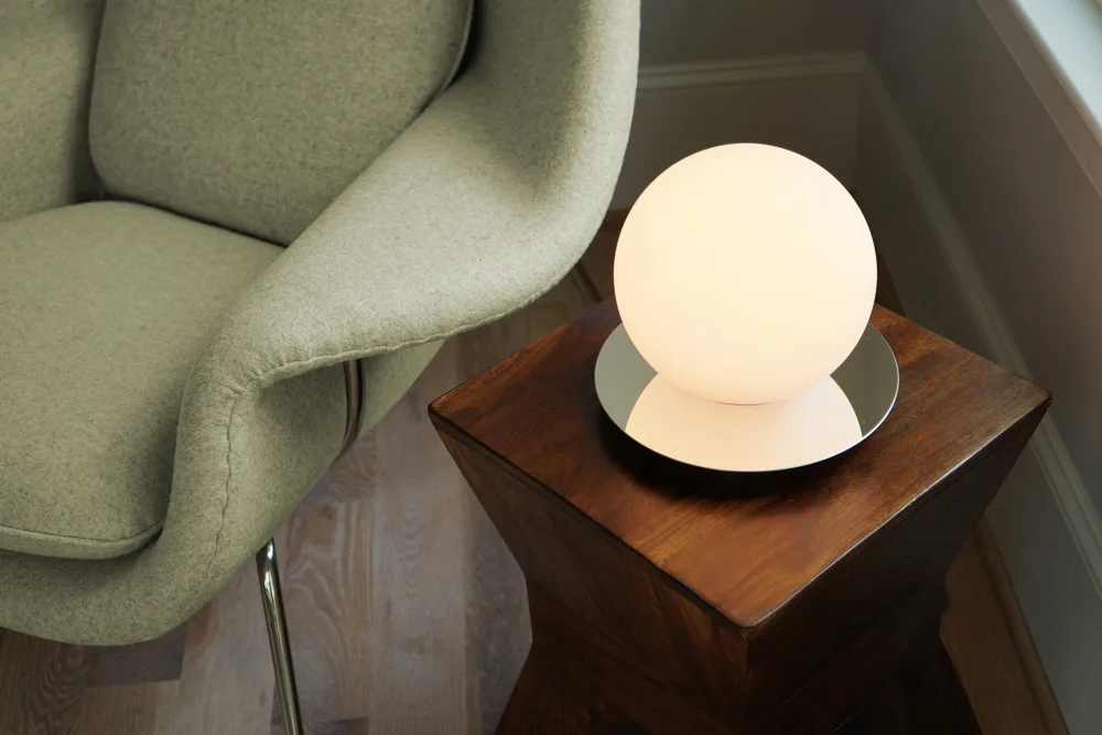 Pablo Bola Sphere Table Lamp - Modern minimalist white glass globe lamp on a chrome base for contemporary living spaces.