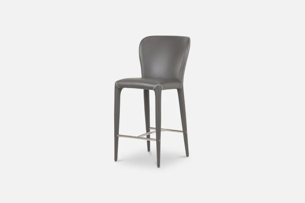 PU Barstool: Sleek PU barstool, providing a stylish and affordable seating solution for your dining area. Discover our PU leather seating options at Bradfords, Auckland, New Zealand. Upholstered with cross stitch detail.