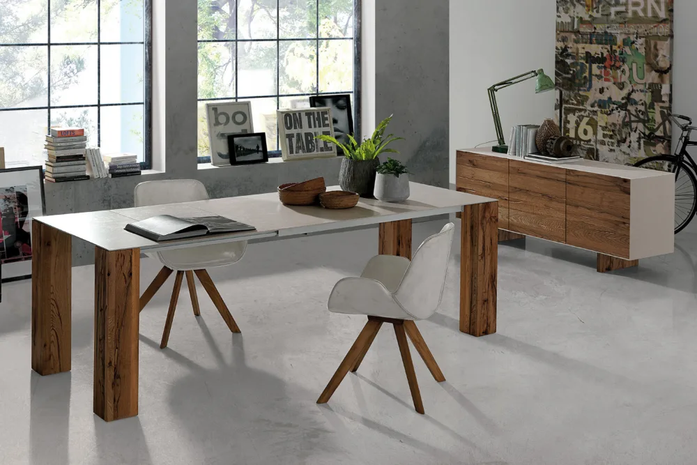 Versatile expandable extension dining table, providing flexibility for accommodating extra guests when needed. Italian designed and made with white ceramic and wooden legs. Discover our expandable table options at Bradfords, Auckland, New Zealand.