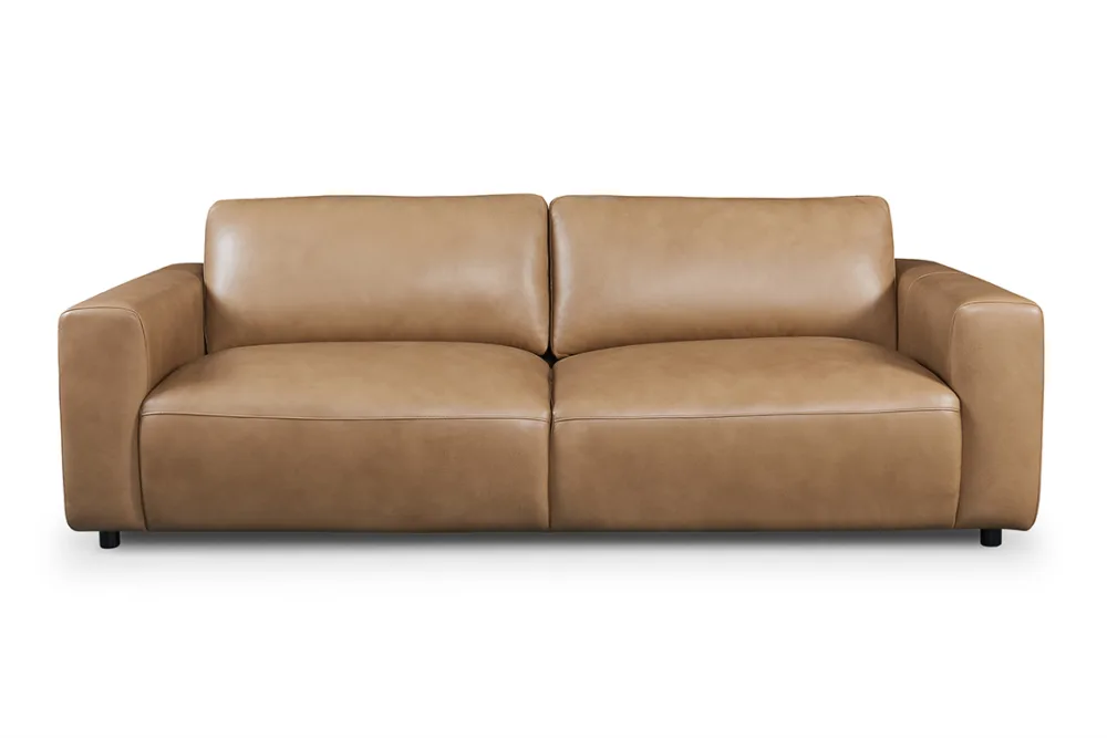 LUCA sofa or couch, combining modern style with unmatched comfort. Featuring a low profile and deep seating, this large-scale couch is perfect for lounging. Stocked in premium leather and available in fabric, the LUCA ensures a perfect fit for any living space. Ideal for searches related to modern sofas, leather couches, fabric sofas, and stylish lounge furniture