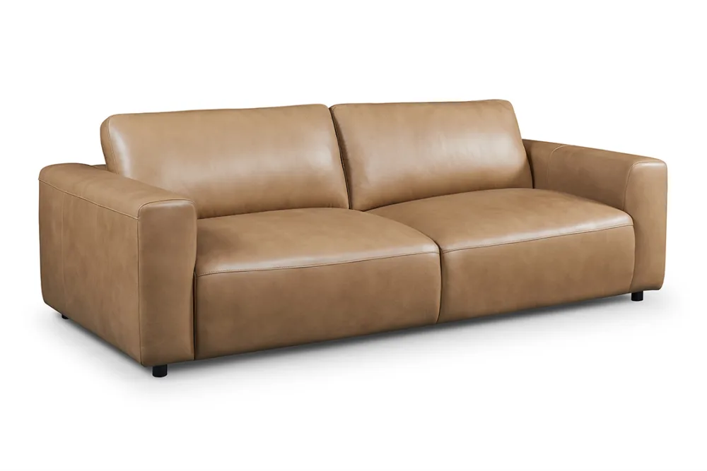 LUCA sofa or couch, combining modern style with unmatched comfort. Featuring a low profile and deep seating, this large-scale couch is perfect for lounging. Stocked in premium leather and available in fabric, the LUCA ensures a perfect fit for any living space. Ideal for searches related to modern sofas, leather couches, fabric sofas, and stylish lounge furniture